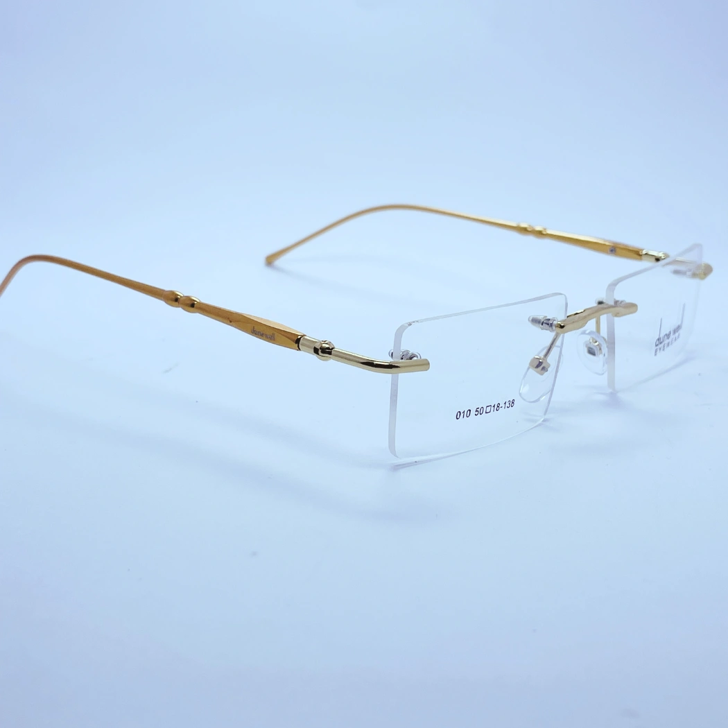 Dune Well rimless 010 Eyeglasses – Angled Side View (Golden) Dune Well rimless 010 Eyeglasses in Golden – angled side view